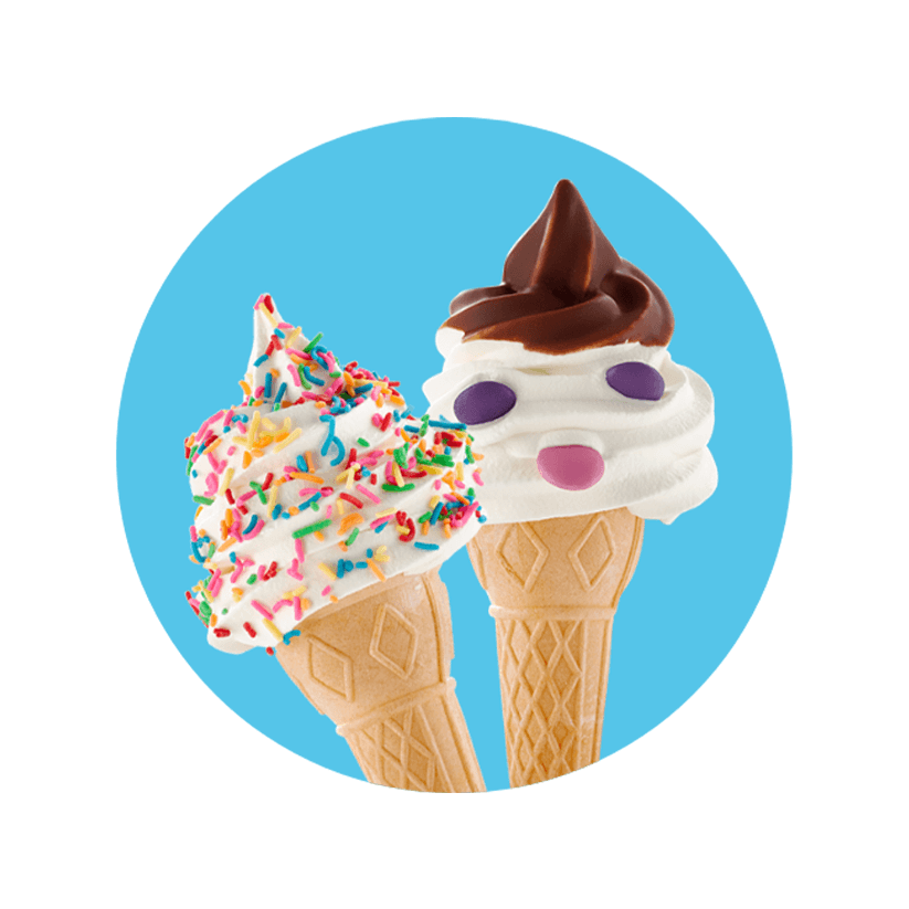 Two ice cream cones with chocolate bits and sprinkles.