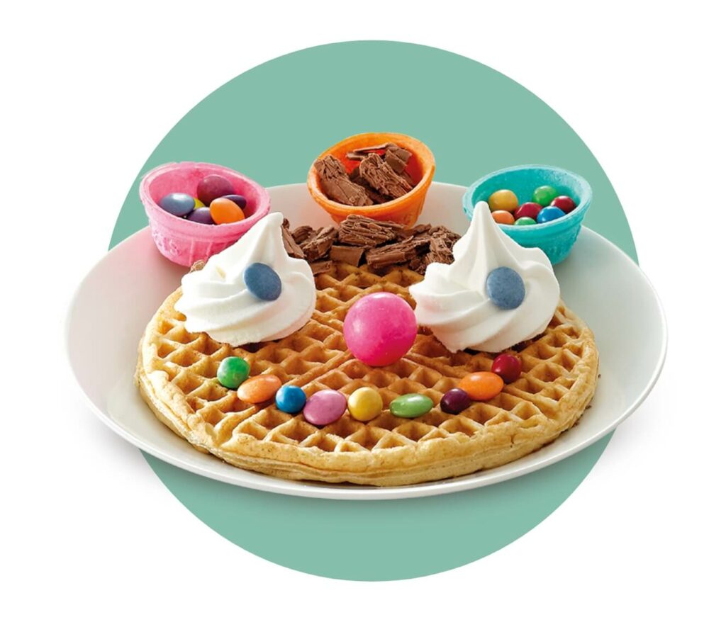 Kids waffle with ice cream and sweets