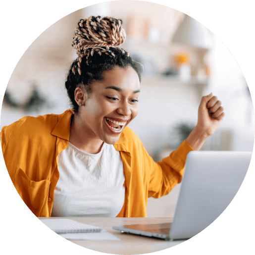 Lady feeling excited in front of her computer