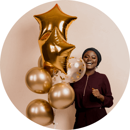 Lady holding golden balloons