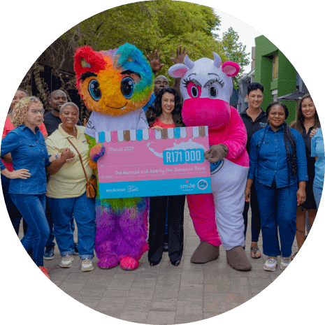 Group of people holding donation check to smile foundation